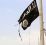 (FILES) In this file photo taken on April 30, 2017 A member of the US-backed Syrian Democratic Forces (SDF) removes an Islamic State group flag in the town of Tabqa, about 55 kilometres (35 miles) west of Raqa city as they advance in their battle for the group's de facto capital.The Islamic State jihadist group has executed one of dozens of Druze hostages abducted from Syria's southern province of Sweida last month, a Syrian news outlet and a monitor said on August 5. IS killed the 19-year-old male student on August 2 after kidnapping more than 30 people, mostly women and children, from a village in Sweida during a deadly rampage on July 25, the head of the Sweida24 news website Nour Radwan said. / AFP PHOTO / DELIL SOULEIMAN